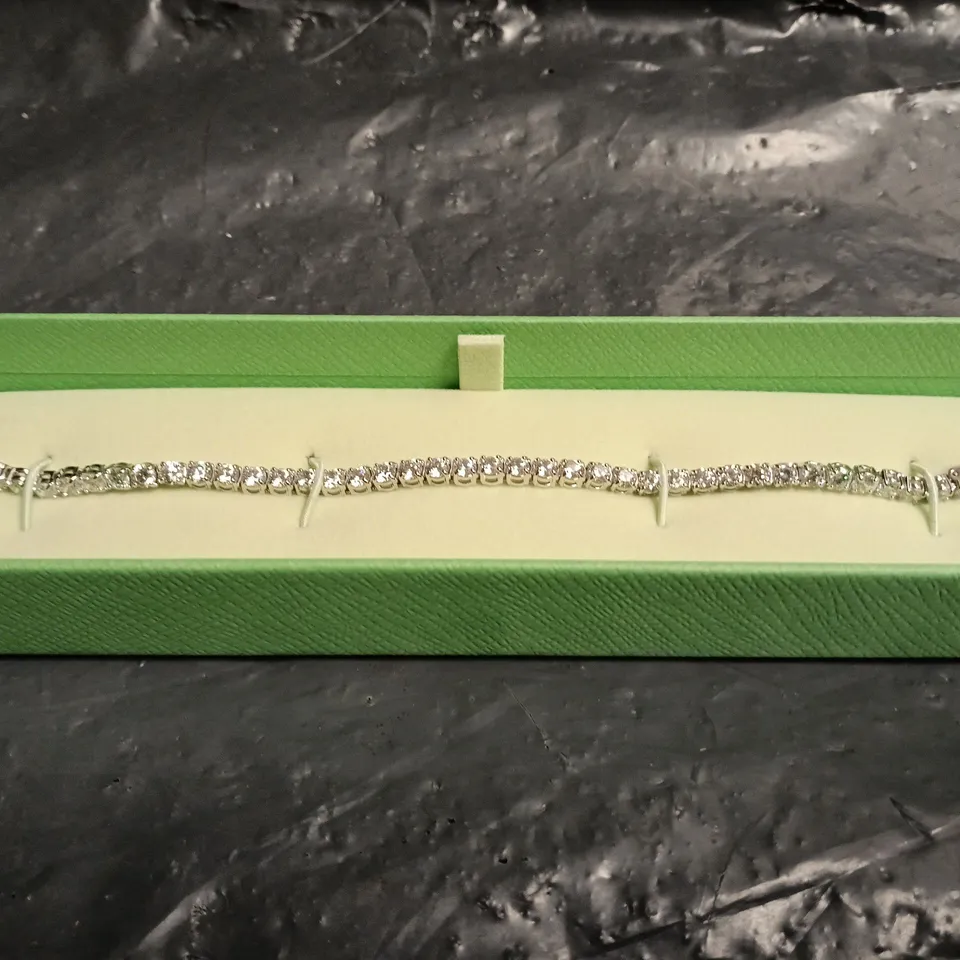 SWAROVSKI BRACELET WITH CLEAR STONES IN SILVER TONE