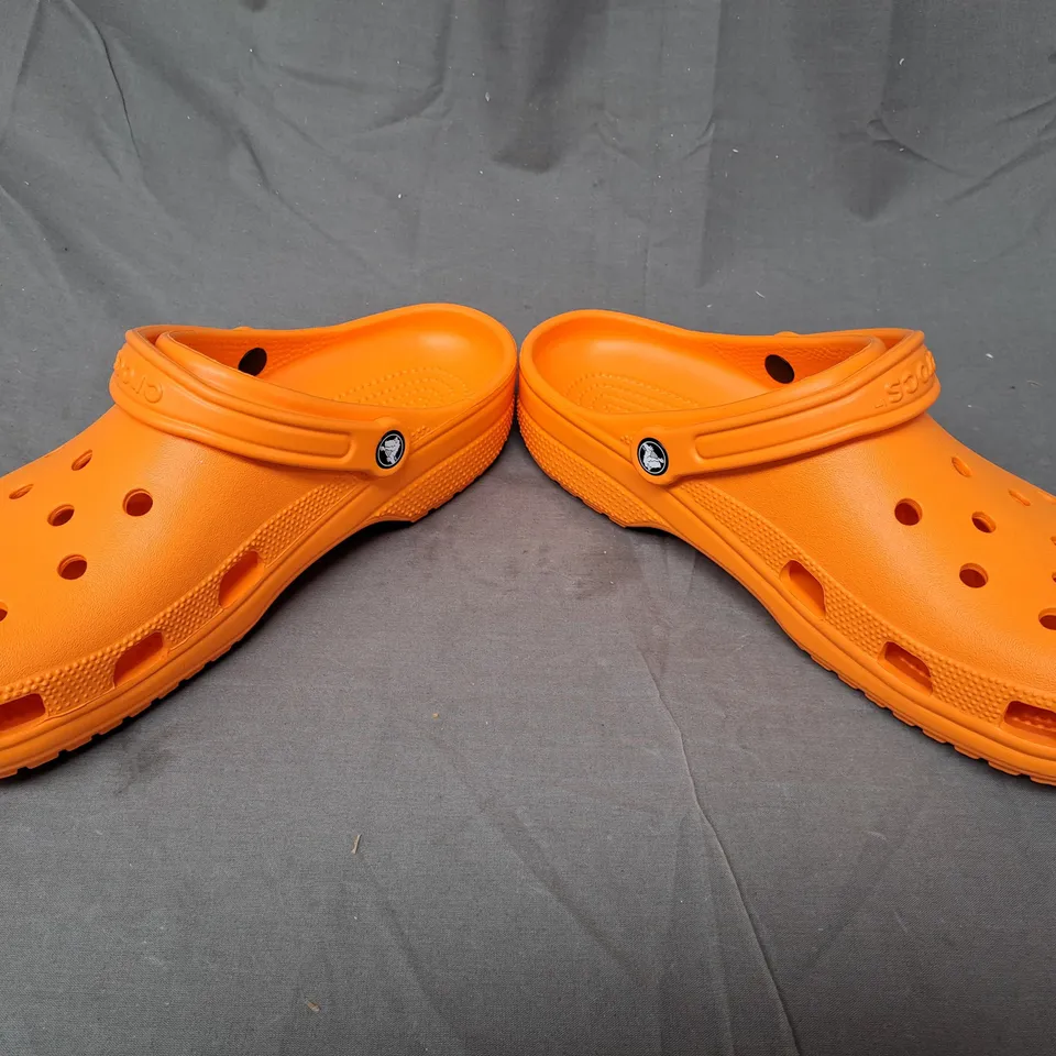 PAIR OF CROCS CLASSIC CLOGS IN ORANGE SIZE M13