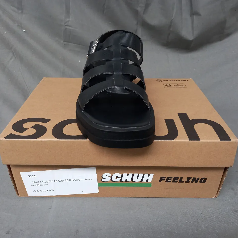 BOXED PAIR OF SCHUH TOBIN CHUNKY GLADIATOR SANDALS IN BLACK SIZE 6
