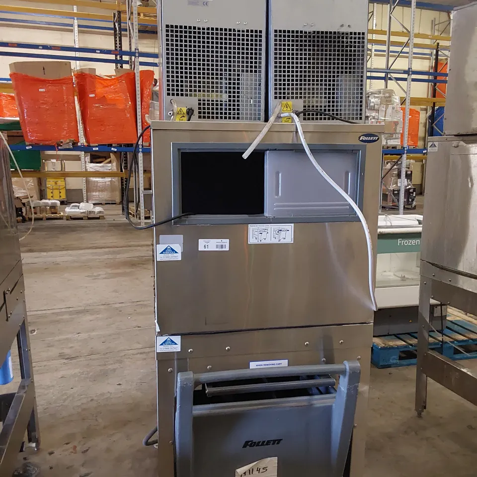 FOLLETT COMMERCIAL ICE MACHINE ON STAND WITH ICE TROLLEY