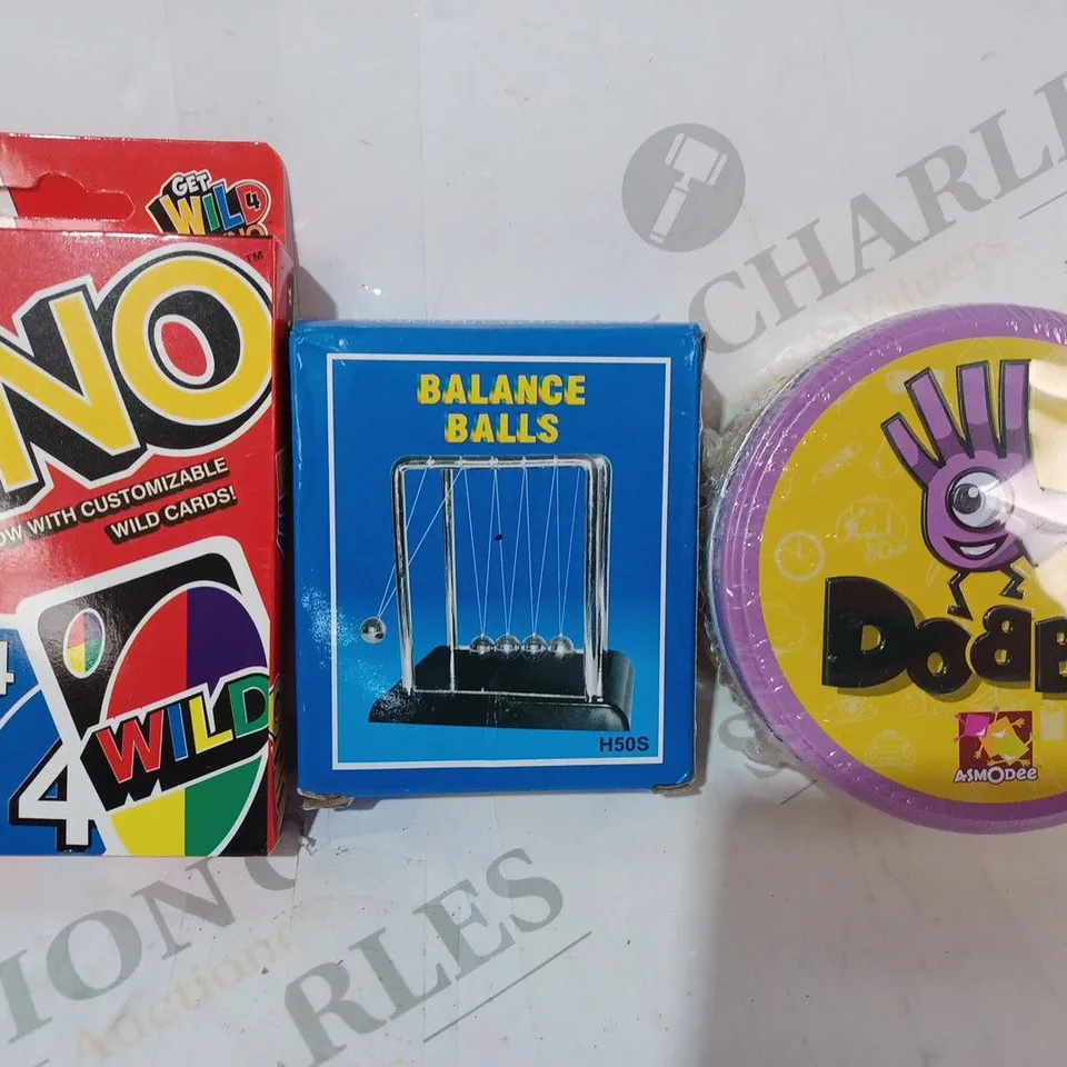 APPROXIMATELY 10 ASSORTED TOYS AND GAMES TO INCLUDE DOBBLE, BALANCE BALLS, UNO, ETC