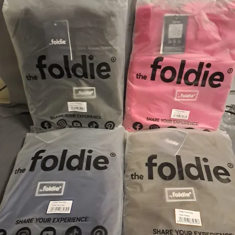 LOT OF 4 THE FOLDIE TRAVEL BAGS - VARIOUS COLOURS