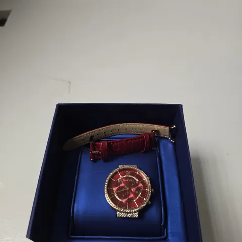 SWAROVSKI WRISTWATCH WITH RED DIAL AND CRYSTAL-SET BEZEL – IN BLUE PRESENTATION BOX