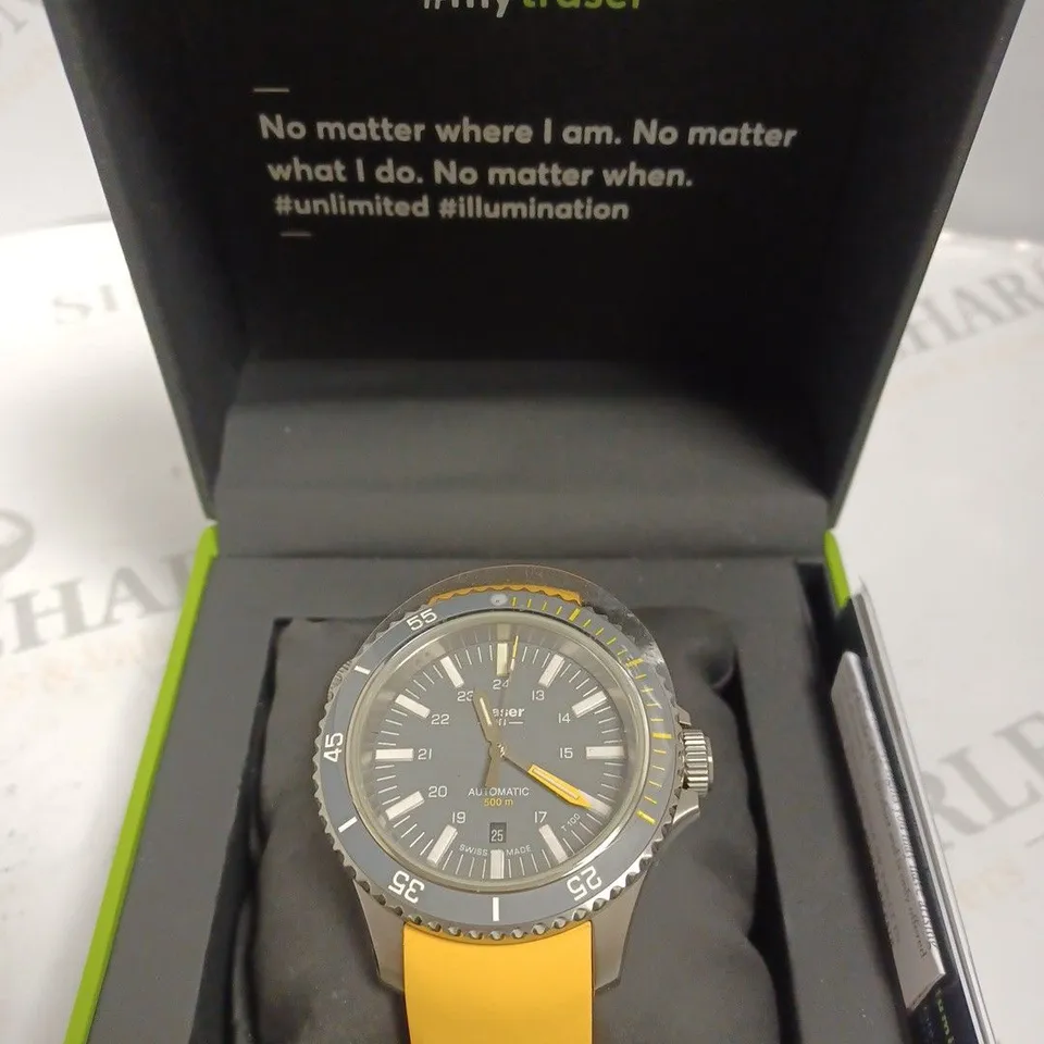 BOXED TRASER WATCH WITH YELLOW SILICONE STRAP AND CHANGEABLE SILVER LINK STRAP, AND TRASER MINI TORCH 
