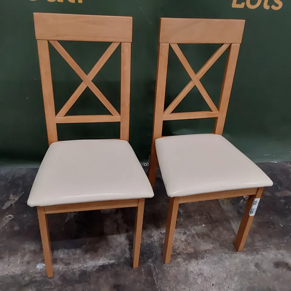 PAIR NATURAL WOOD FRAMED X BACK DINING CHAIRS CREAM PU SEATS
