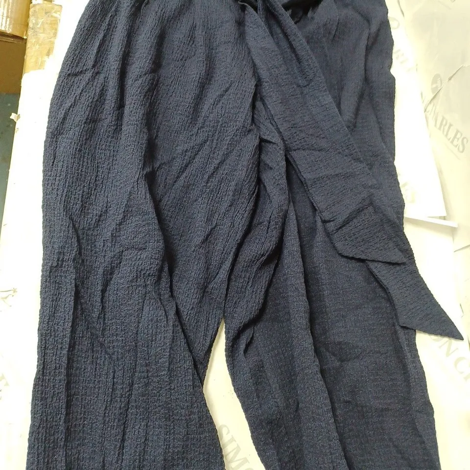 APPROXIMATELY 10 CLOTHING INCLUDING: WIDE LEG TROUSERS, AND SLEEVELESS BLOUSES (OF DIFFERENT SIZES AND COLOURS)