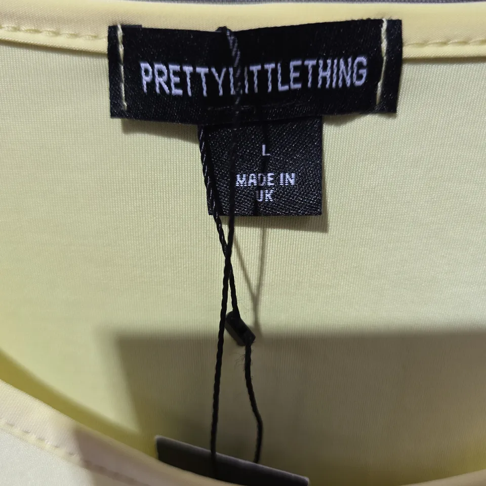 PRETTYLITTLETHING YELLOW T-SHIRT WITH SAN DIEGO CALIFORNIA GRAPHIC – UK L