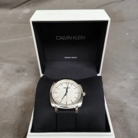 CALVIN KLEIN SWISS MADE WRISTWATCH – WHITE DIAL, STAINLESS STEEL CASE & BLACK RIBBED STRAP 