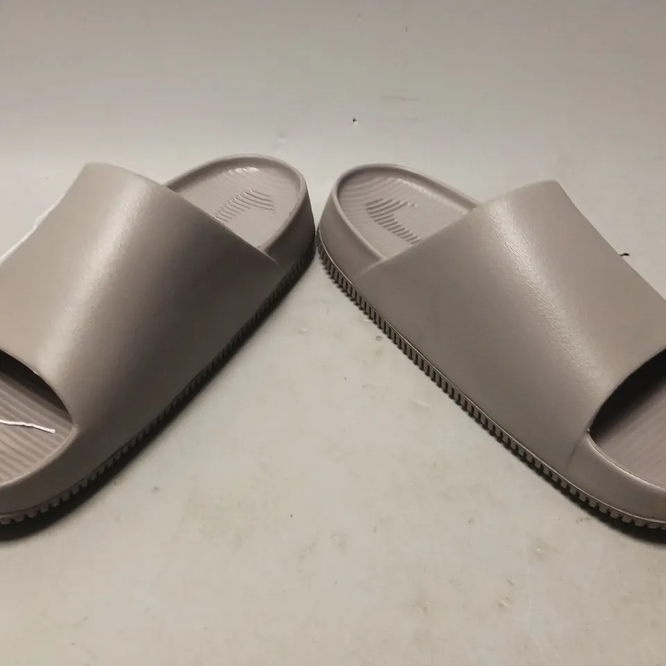 PAIR OF NIKE CALM SLIDERS IN GREY UK SIZE M8/W7.5