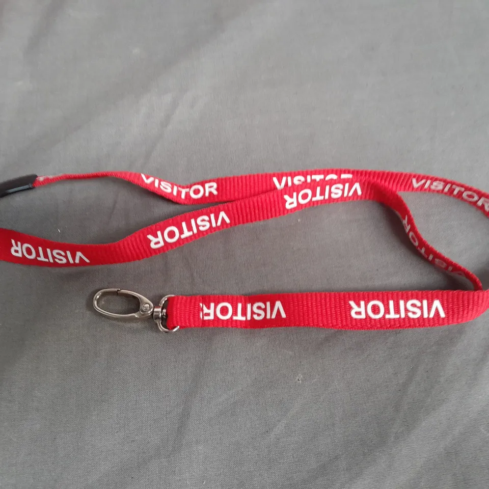 LOT OF APPROXIMATELY 900 RED VISITOR BRANDED LANYARDS