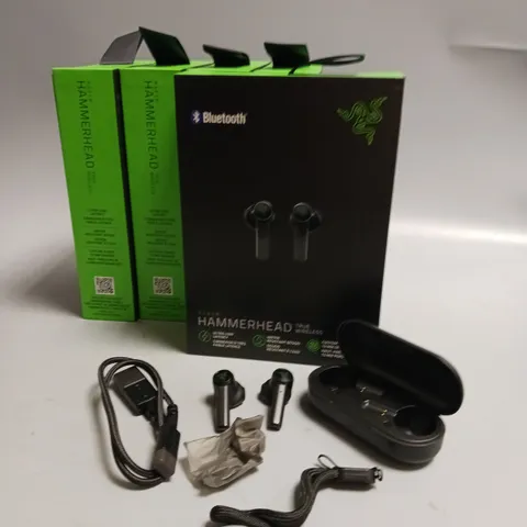 LOT OF 5 BOXED RAZER WIRELESS HEADPHONES IN BLACK AND GREEN INCLUDES CHARGING CASE, CABLE AND WRIST STRAP