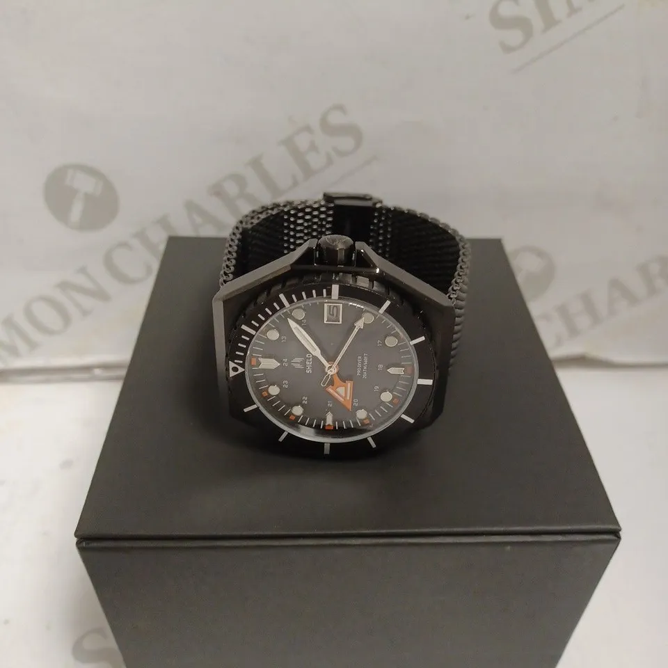 BOXED SHIELD WATCH - STAINLESS STEEL - JAPAN MOVEMENT - WATER RESISTANT 20 ATM - DATE DIAL.