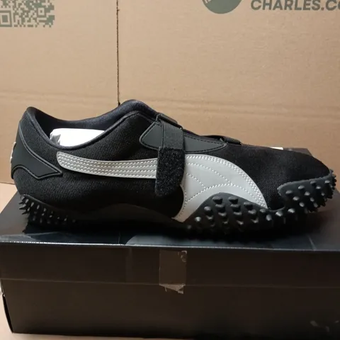 BOXED PAIR OF PUMA MOSTRO OG TRAINERS IN BLACK - UK 12