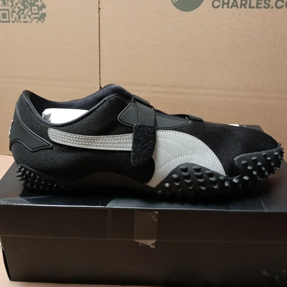 BOXED PAIR OF PUMA MOSTRO OG TRAINERS IN BLACK - UK 12