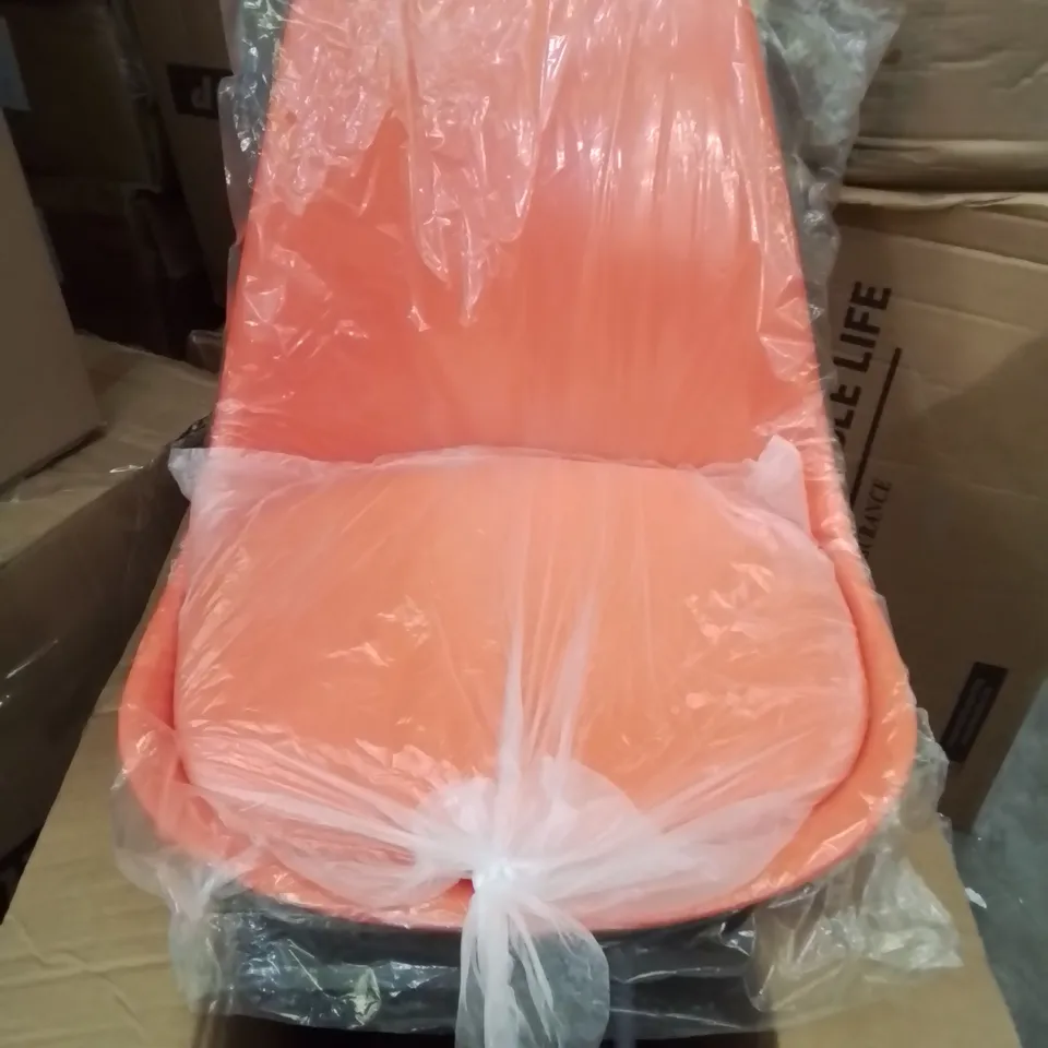 A BOXED BRIGHT ORANGE FAUX LEATHER UPHOLSTERED OFFICE DESK CHAIR/SIDE CHAIR