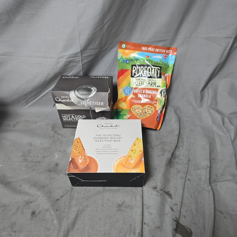 APPROXIMATELY 8 ASSORTED ITEMS OF FOOD AND DRINK INCLUDING PUREOATY GLEBE FARM MAPLE AND BANANA GRANOLA 325G, HOTEL CHOCOLAT BISCUIT SELECTION AND DRINKING CHOCOLATE SELECTOION