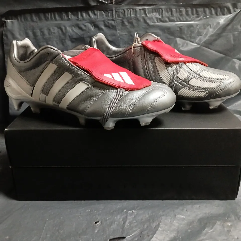 BOXED PAIR OF ADIDAS PREDATOR MANIA FOOTBALL BOOTS IN GUNMETAL/RED SIZE UK 8