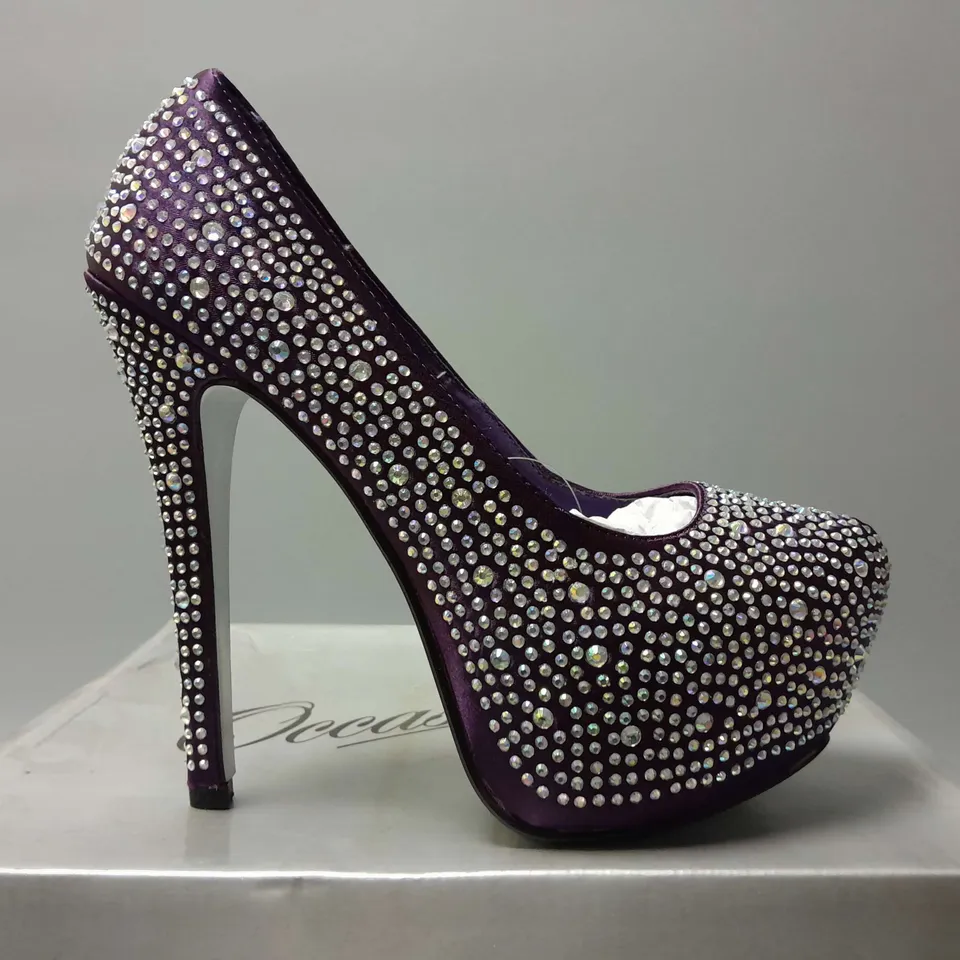 APPROXIMATELY 5 ASSORTED BOXED PAIRS OF OCCASIONS BY CASANDRA DECORATED HEELS IN PURPLE IN VARIOUS COLOURS