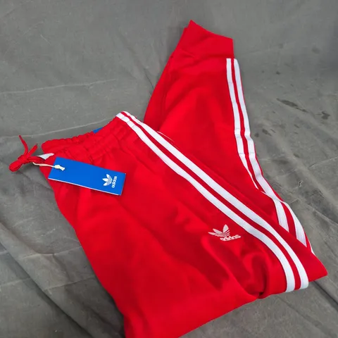 ADIDAS RED TRACK PANTS WITH WHITE STRIPES, UK M