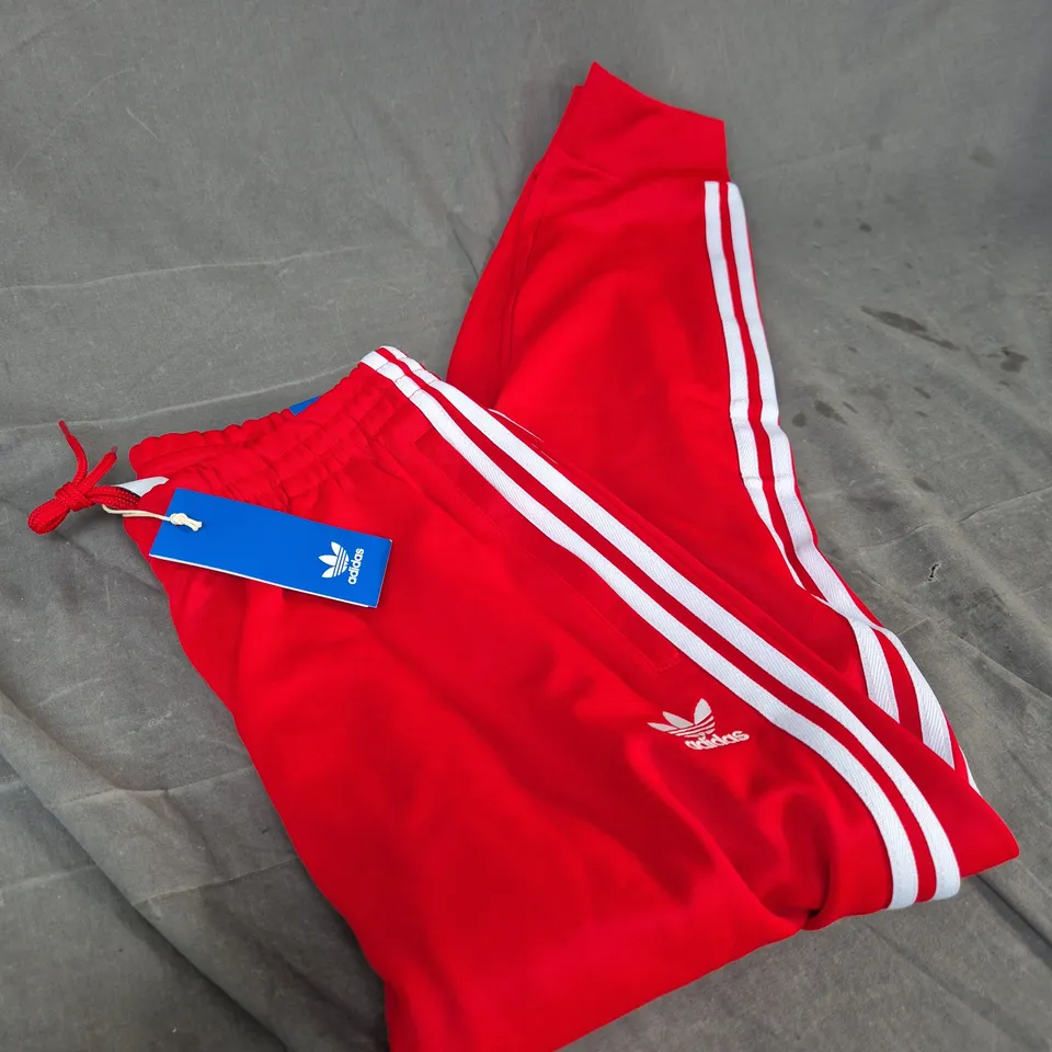 ADIDAS RED TRACK PANTS WITH WHITE STRIPES, UK M 