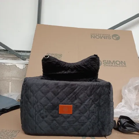 BLACK QUILTED DOG BED WITH TAN LEATHER LOGO PATCH 