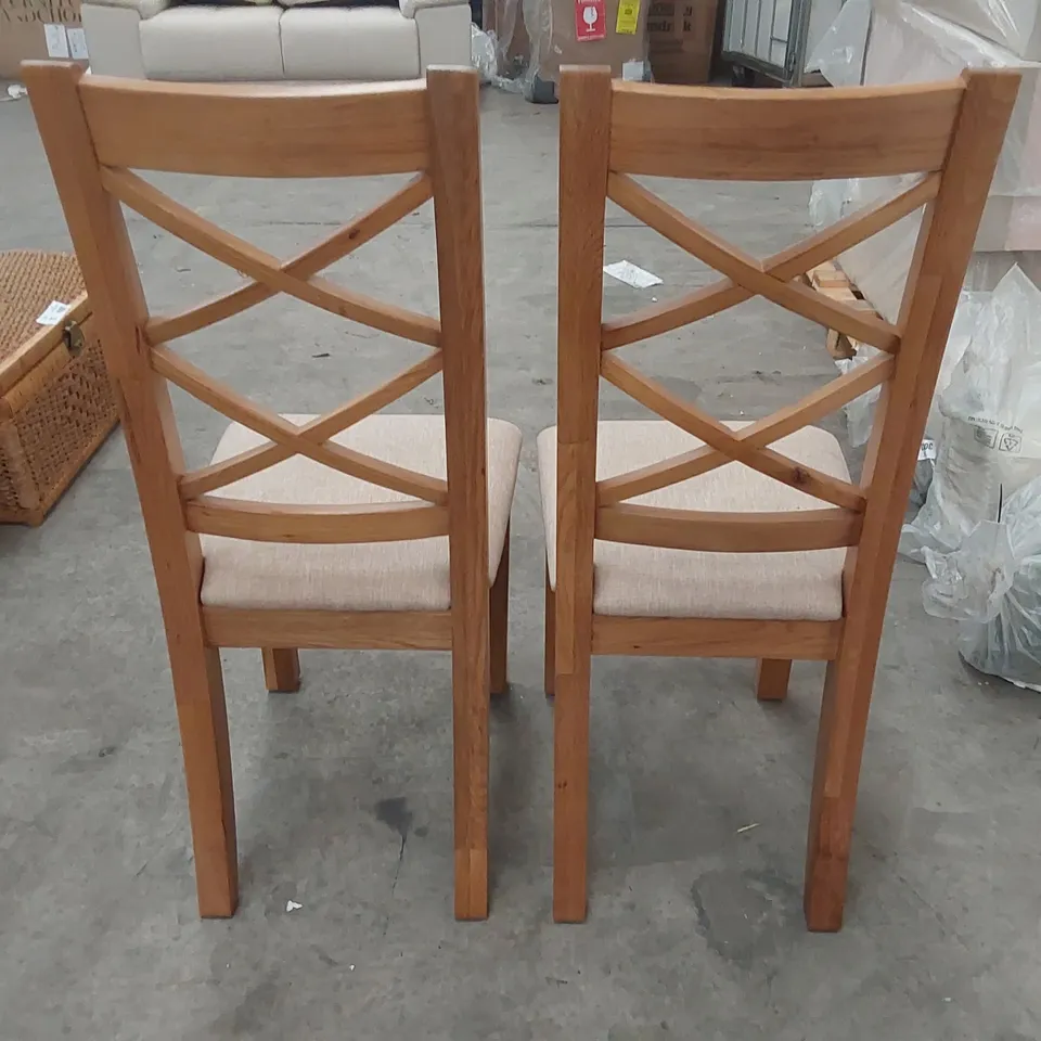 PAIR OF DESIGNER CROSS BACK WOODEN DINING CHAIRS WITH UPHOLSTERED PADDING