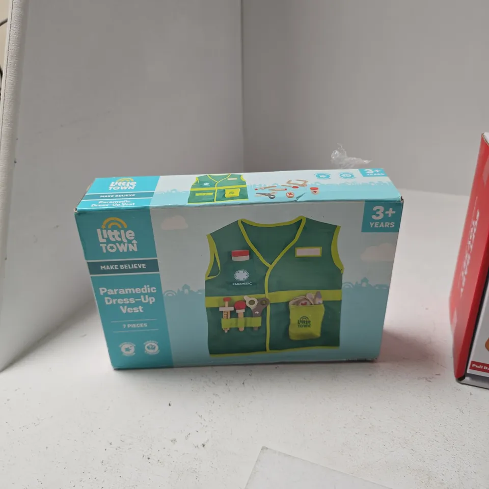 BOX OF APPROXIMATELY 15 ASSORTED TOYS INCLUDING LITTLE TOWN PARAMEDIC DRESS UP VEST , SOFT BABY TOY SET AND TRI OMINOS 