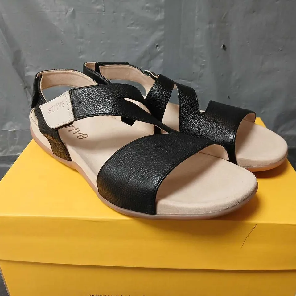 BOXED PAIR OF STRIVE JINNY SANDALS IN BLACK - SIZE 7