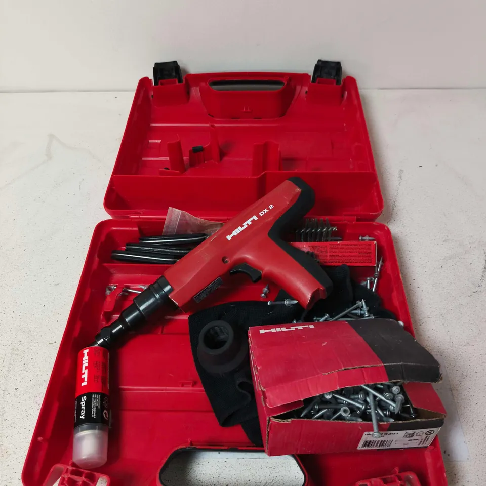 HILTI DX 2 POWDER-ACTUATED FASTENER GUN WITH RED CASE & ACCESSORIES