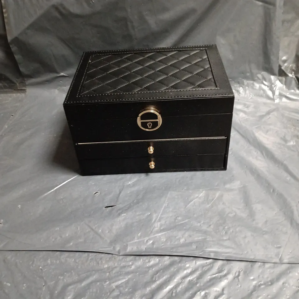 Black leather jewellery box with quilted lid and multi-compartment interiors