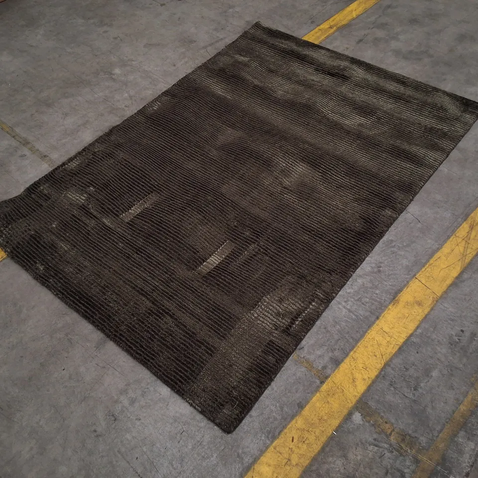 DARK RECTANGULAR RUG WITH SUBTLE LINEAR PATTERN APPROXIMATELY 120×180CM