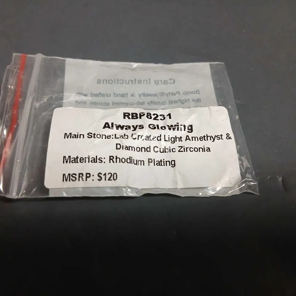 RHODIUM-PLATED RING WITH TWO AMETHYST STONES AND CLEAR CUBIC ZIRCONIA