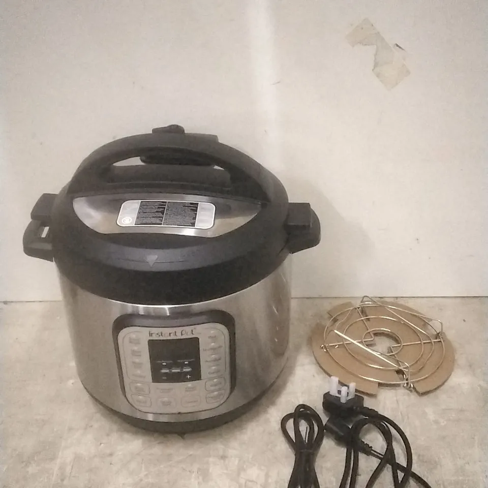 BOXED INSTANT POT MULTI USE PRESSURE COOKER 