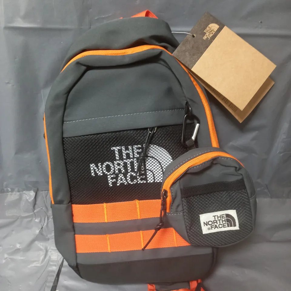 THE NORTH FACE SINGLE STRAP BAG IN BLACK/ORANGE 