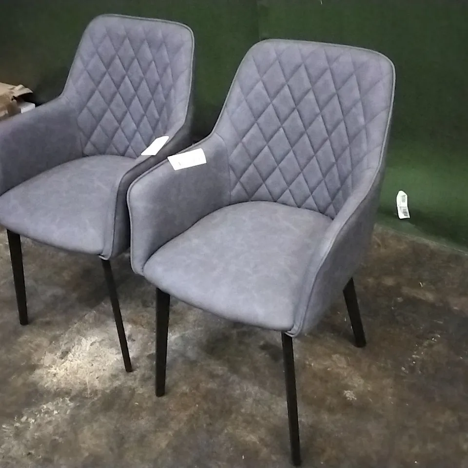 DESIGNER PAIR OF GREY LEATHER PILLOWED DINING CHAIRS WITH ARMREST AND BLACK LEGS