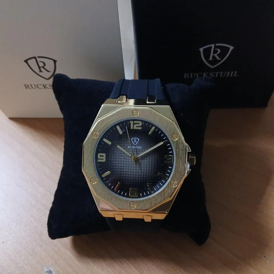 RUCKSTUHL GOLD-TONE WRISTWATCH WITH BLACK DIAL 