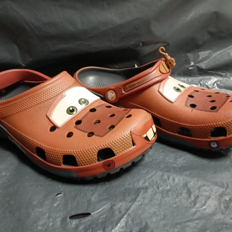 PAIR OF CROCS DISNEY PIXAR CARS TOW MATER CLOGS SIZE UK M9/W10