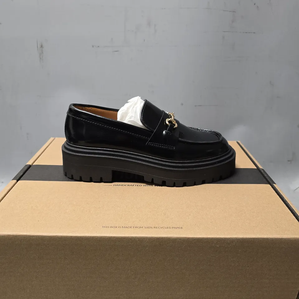 BOXED THURSDAY GOLD & BLACK PENNY PLATFORM SHOES - SIZE 6