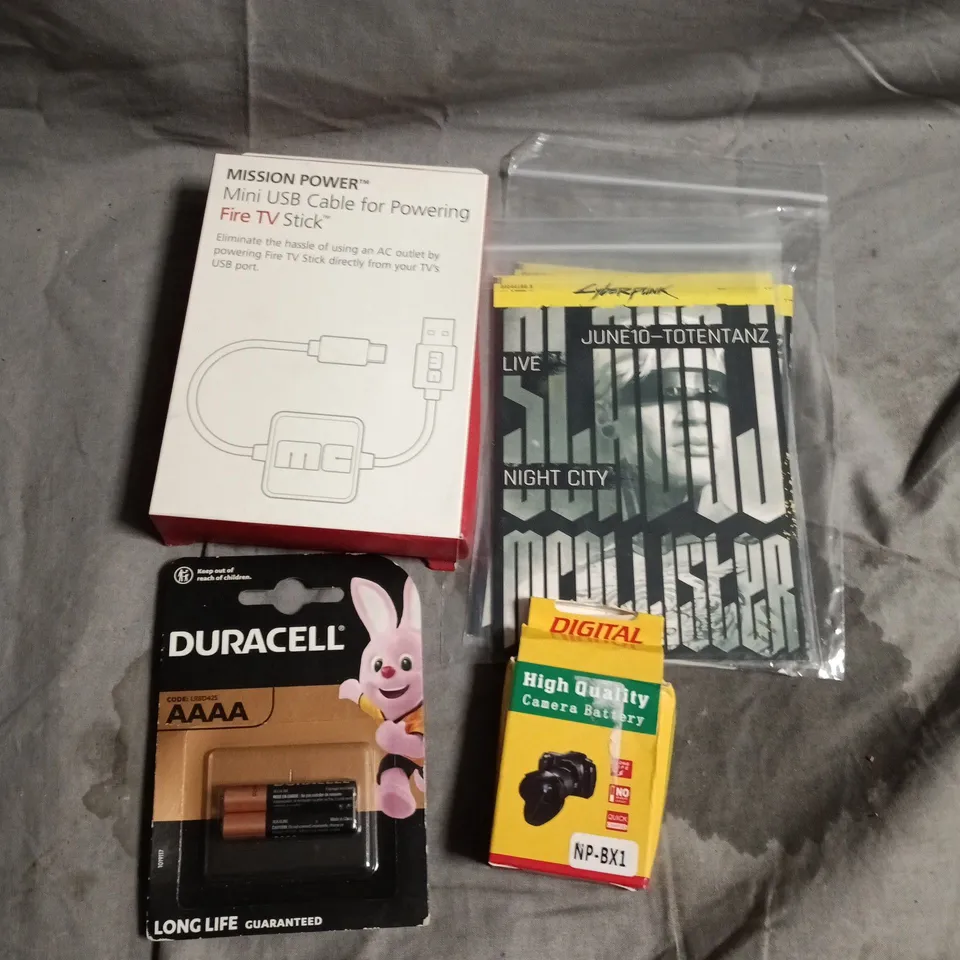 APPROXIAMTELY 20 ASSORTED HOUSEHOLD PRODUCTS TO INCLUDE POSTCARDS, BATTERIES, POWER CABLE ETC 