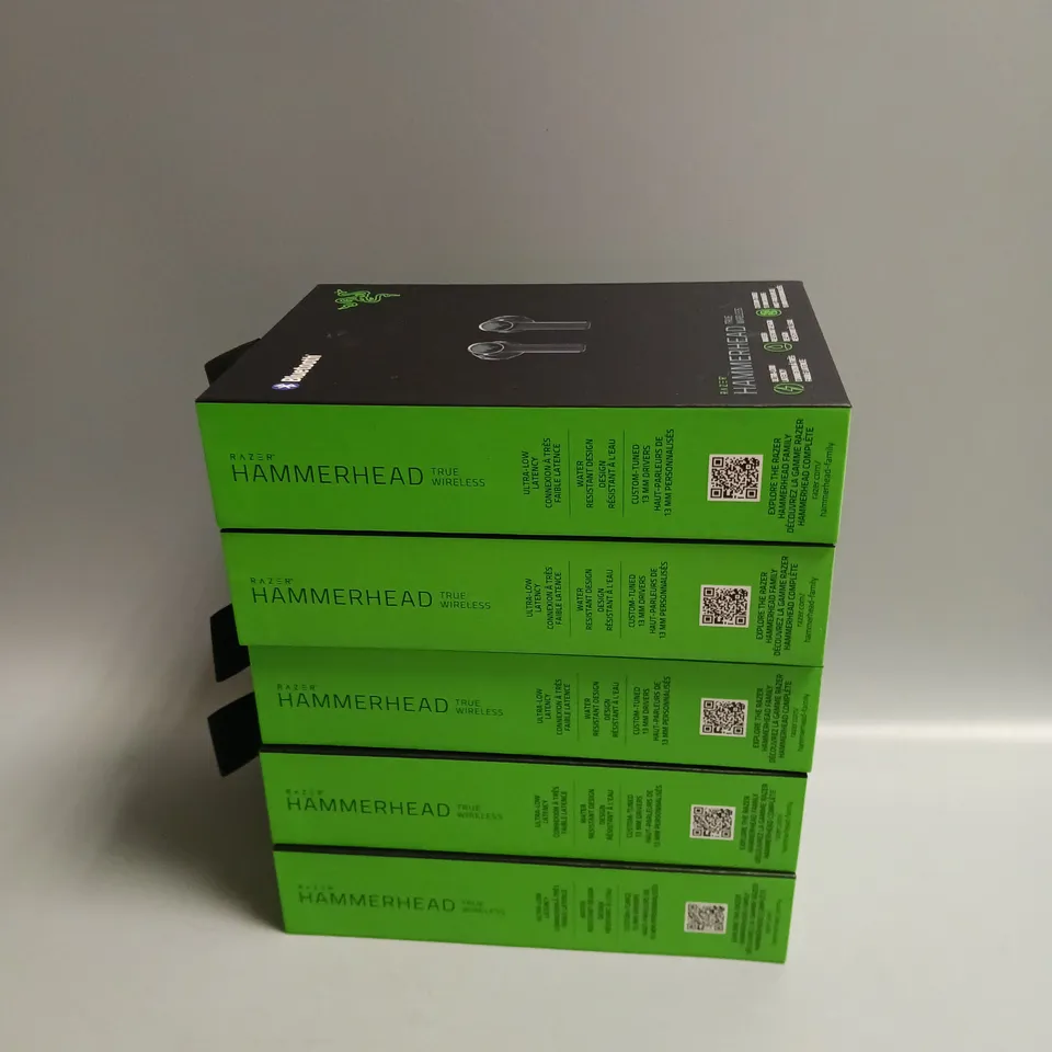 LOT OF 5 BOXED RAZER WIRELESS HEADPHONES IN BLACK AND GREEN INCLUDES CHARGING CASE, CABLE, WRIST STRAP AND SPARE BUDS