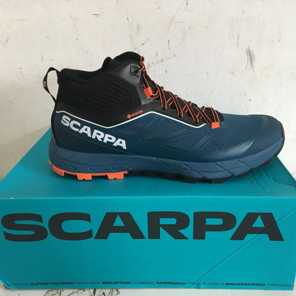 BOXED PAIR OF SIZE 9.5 SCARPA RAPID MID GTX COSMIC BLUE/ORANGE TRAINERS 