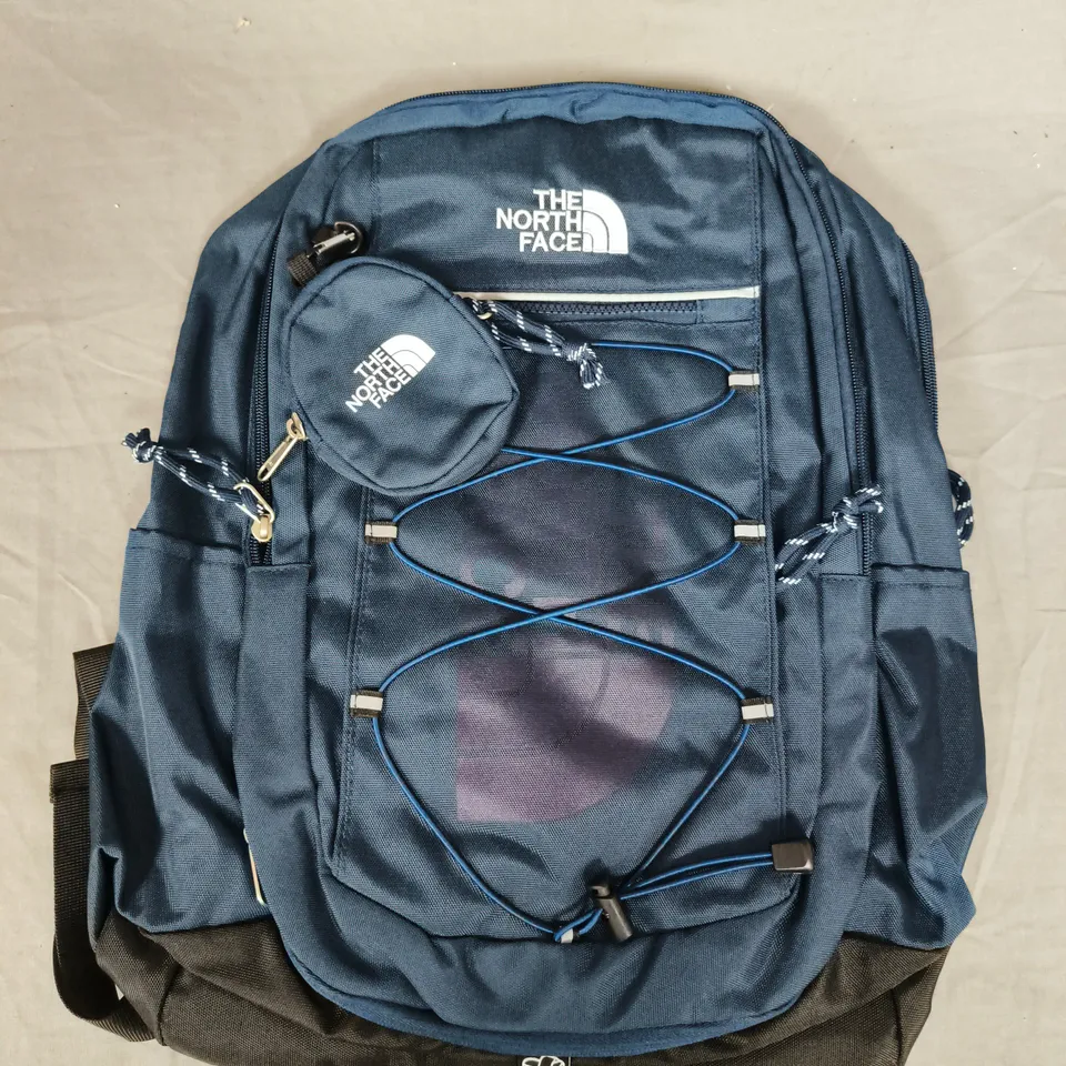 THE NORTH FACE BACKPACK – BLUE WITH FRONT BUNGEE CORD AND SMALL POUCH