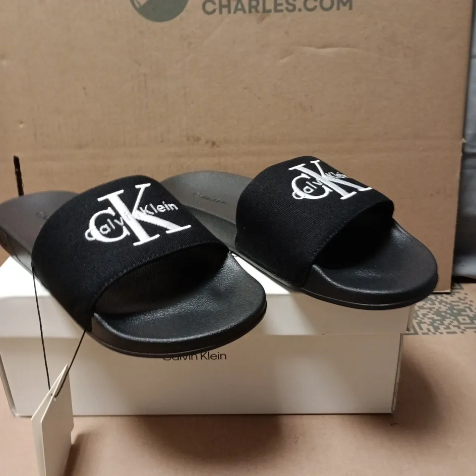 CALVIN KLEIN TRIPLE BLACK SLIDE SANDALS – MEN’S UK 9 (EU 43)