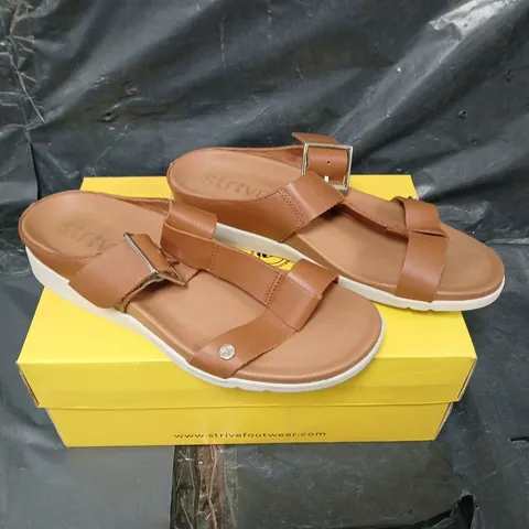 BOXED PAIR OF STRIVE SANTORINI SANDAL IN TAN - SIZE 7