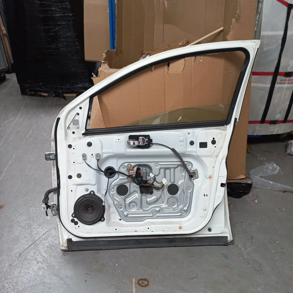 UNBOXED WHITE VEHICLE DOOR WITH INTEGRATED ELECTRONICS