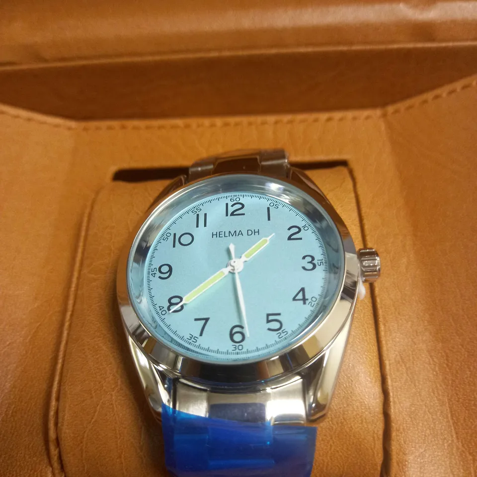 BOXED HELMA DH WATCH WITH PALE BLUE FACE IN SILVER