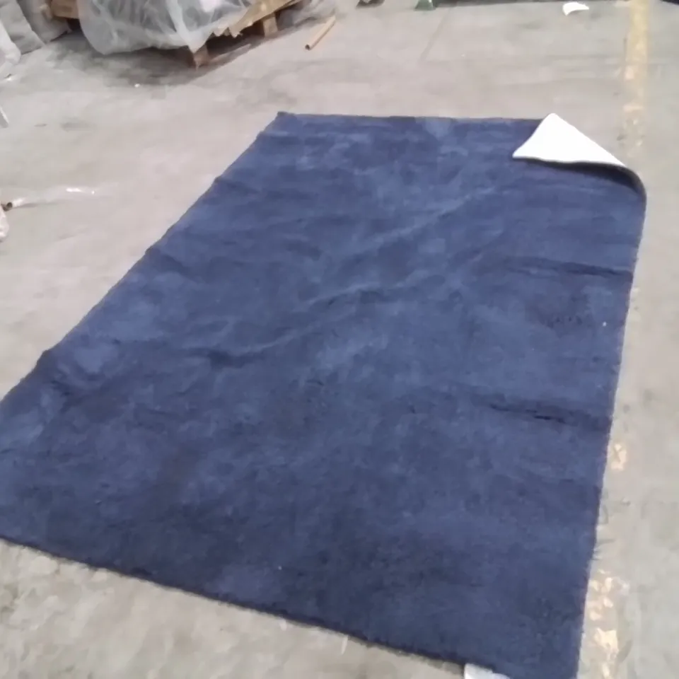 STILLAGE OF APPROXIMATELY 20 QUALITY DESIGNER RUGS