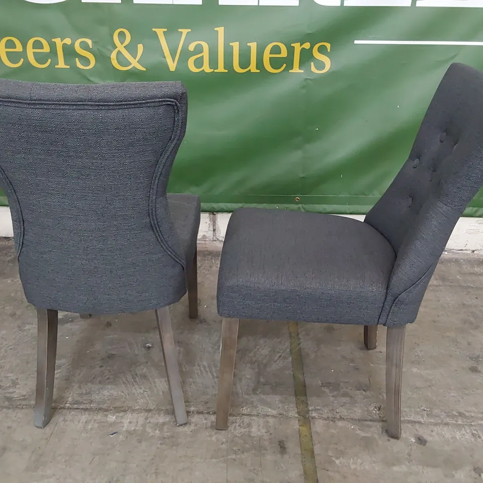 PAIR OF UPHOLSTERED BUTTONED BACK DINING CHAIRS CHARCOAL FABRIC ON SILVERED WOOD LEGS 