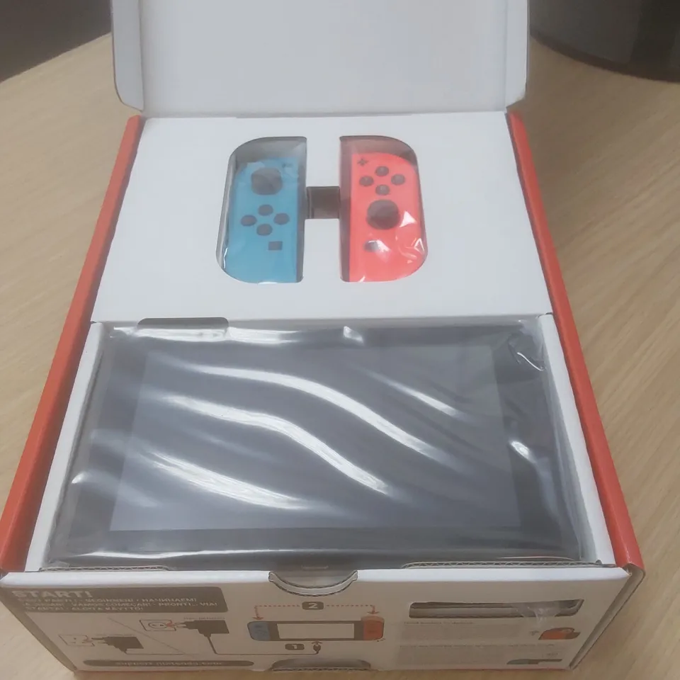 BOXED NINTENDO SWITCH 32GB - NEON RED & BLUE CONTROLLERS