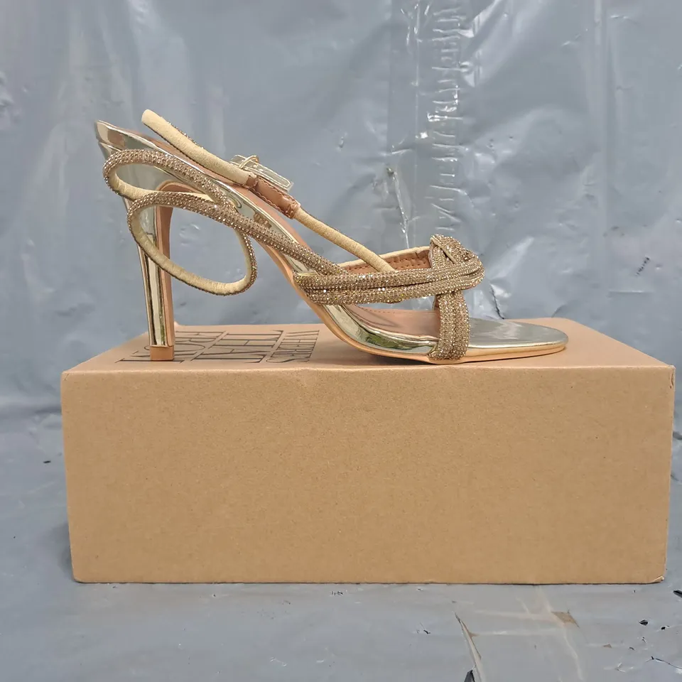 BOXED PAIR OF WHERE'S THAT FROM OPEN TOE STILETTO HEEL SANDAL IN METALLIC GOLD SIZE UK 7